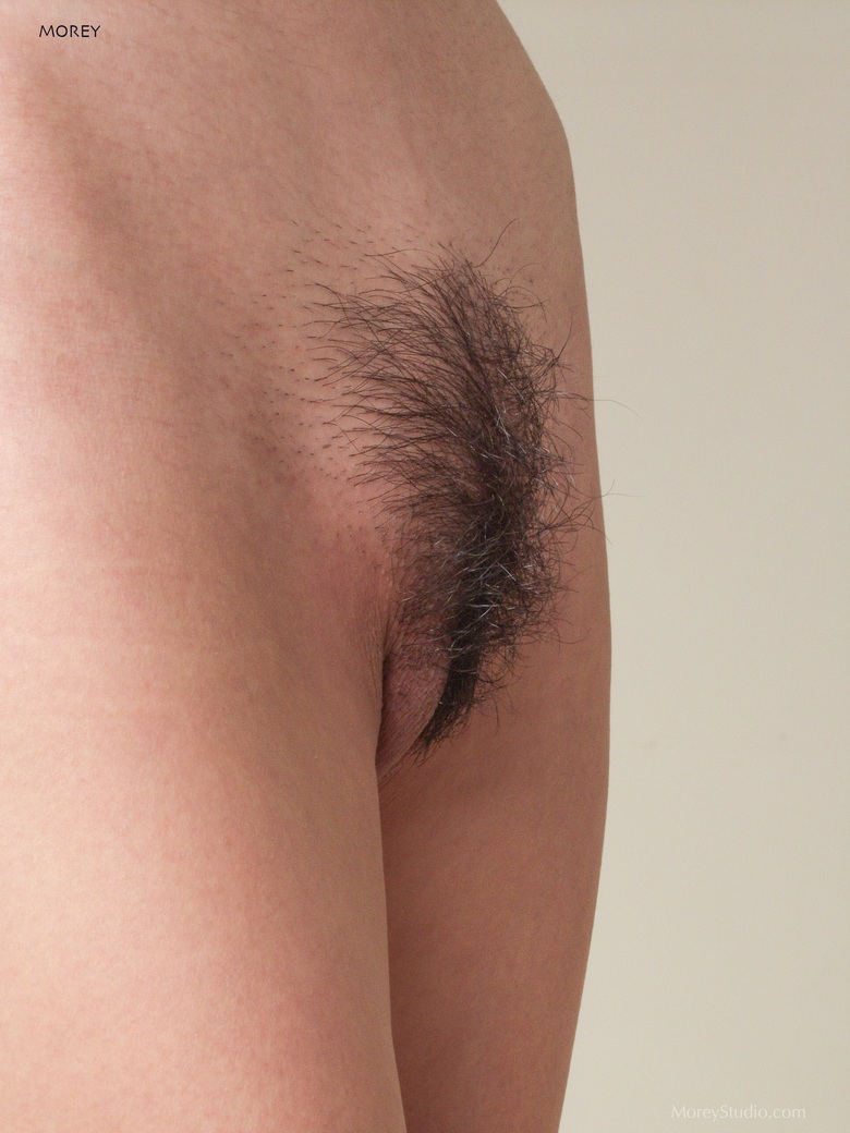 Hana displays her hairy pussy