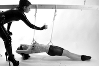 Naked chick is tied, by her master