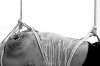 Naked chick is tied, by her master