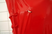 Blond babe is bound in air tight latex
