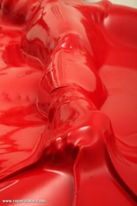 Blond babe is bound in air tight latex