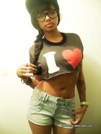 Busty mulatto chick's selfpics