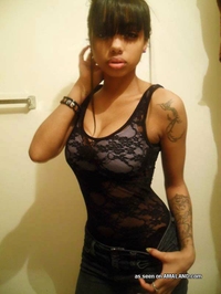 Busty mulatto chick's selfpics