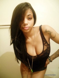 Busty mulatto chick's selfpics