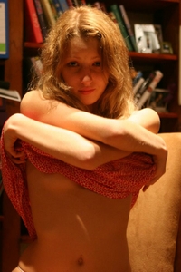 Teenie gets naked on the chair